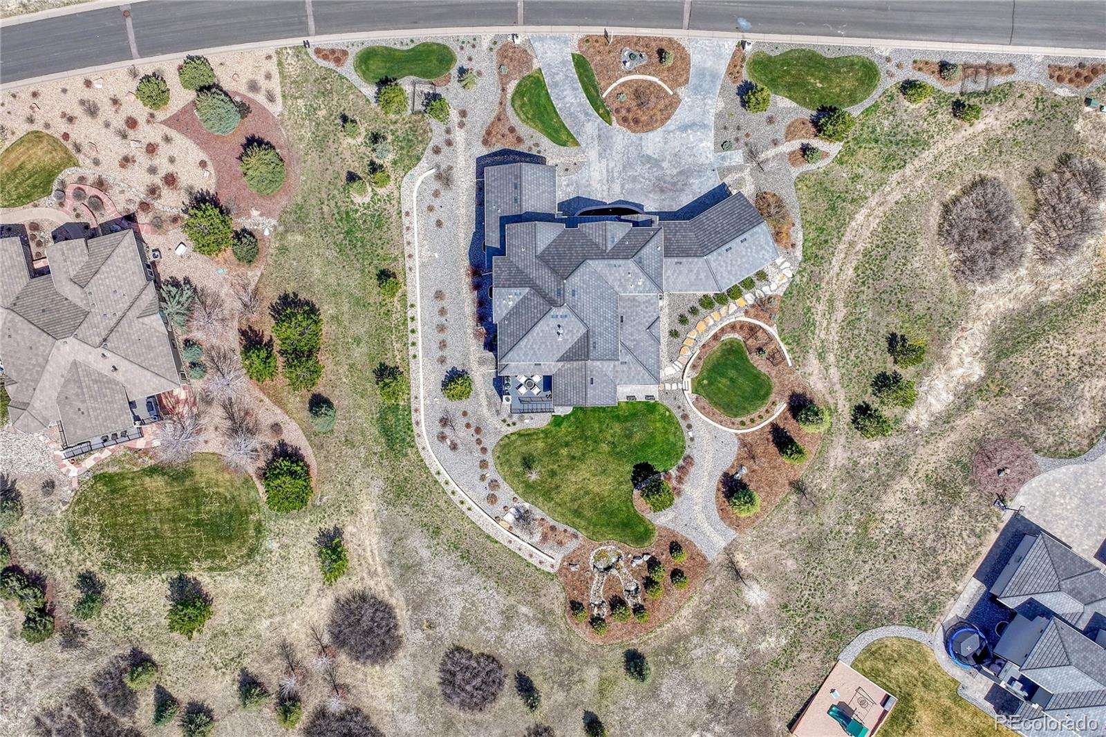 5151 Raintree Circle Parker, CO 80134 - Photo 50 of 50 an aerial view of a house with a yard and garden