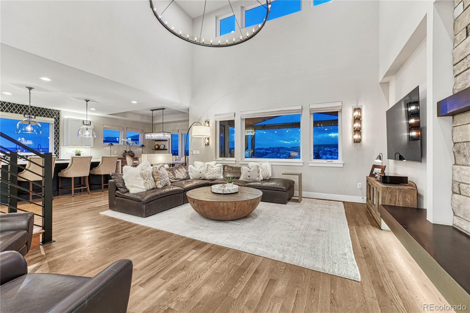 5151 Raintree Circle Parker, CO 80134 - Photo 6 of 50 a living room with furniture and a wooden floor