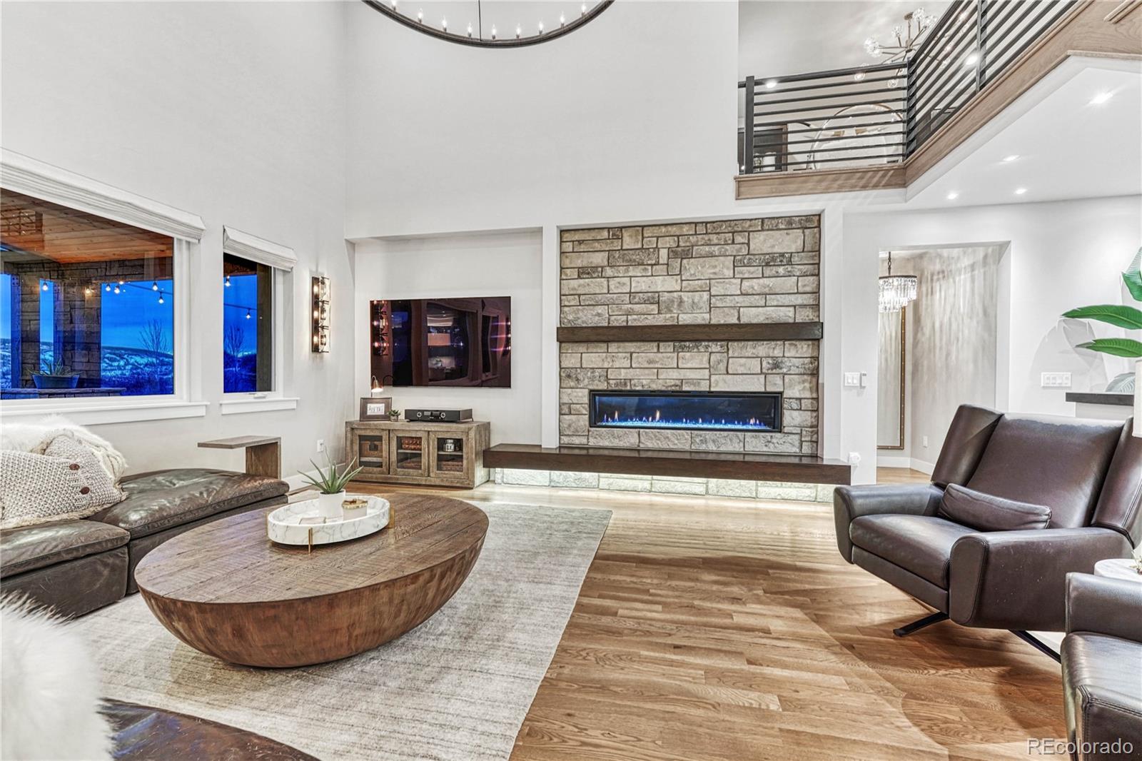 5151 Raintree Circle Parker, CO 80134 - Photo 7 of 50 a living room with furniture and a fireplace