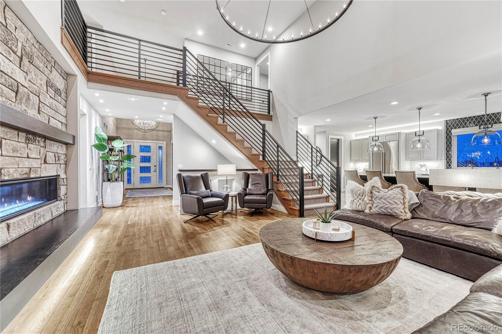 5151 Raintree Circle Parker, CO 80134 - Photo 8 of 50 a living room with furniture and a fireplace