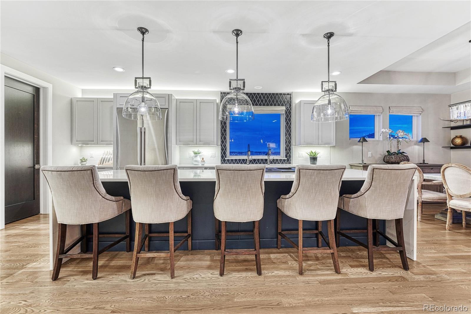 5151 Raintree Circle Parker, CO 80134 - Photo 9 of 50 a view of kitchen and dining area with furniture