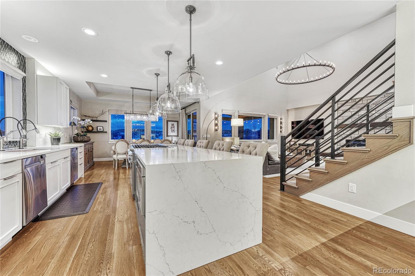 5151 Raintree Circle Parker, CO 80134 - Photo 10 of 50 a large white kitchen with lots of counter space wooden floor and appliances