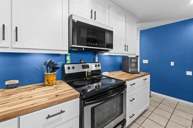 a bathroom with a sink toilet tub and shower