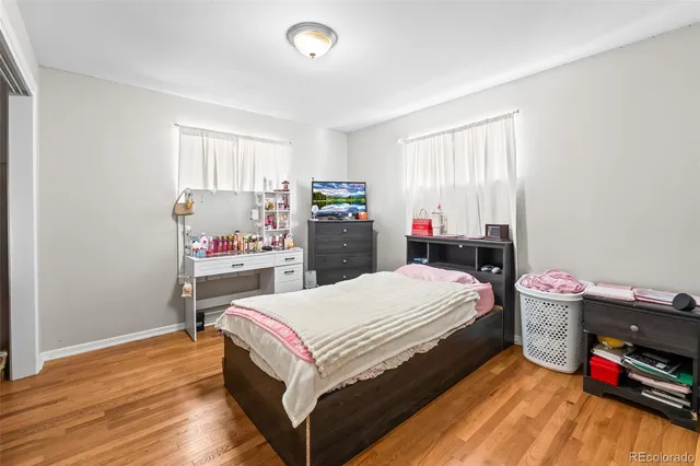 a bedroom with a bed and a closet