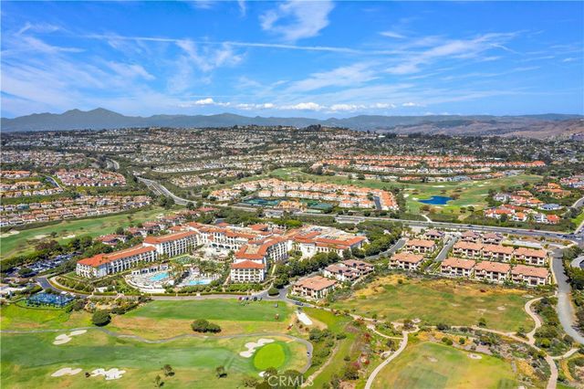 an aerial view of residential building with ocean view