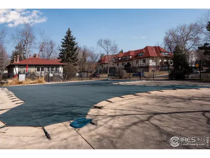 a view of a swimming pool with an outdoor space and seating area