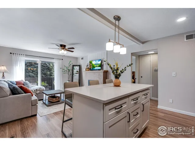 a view of kitchen center island and living room view