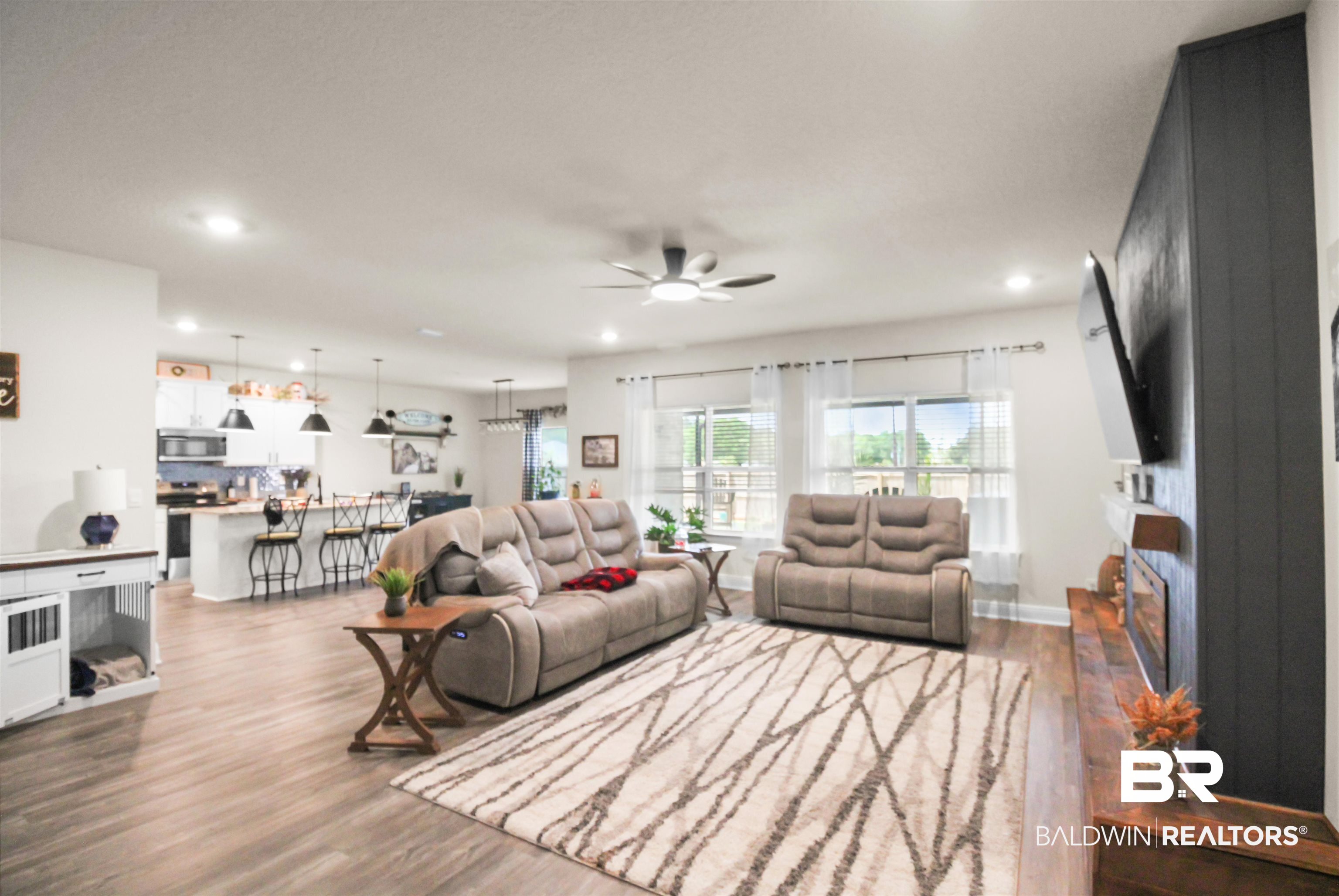 12523 Pheasant Run Elberta, AL 36530 - Photo 41 of 43 Living room with dark wood-style flooring, ceiling fan, and recessed lighting