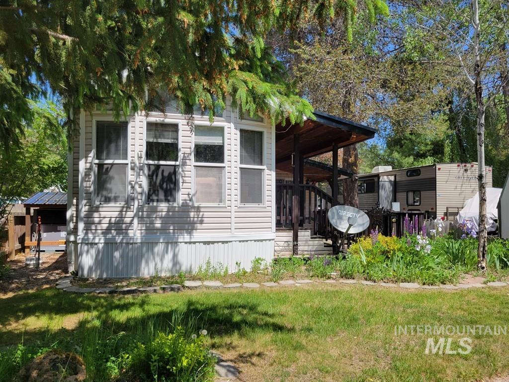 21 E Street Cascade, ID 83611 - Photo 16 of 26 View of home's exterior featuring a yard