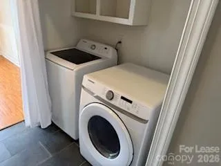a utility room with dryer and washer