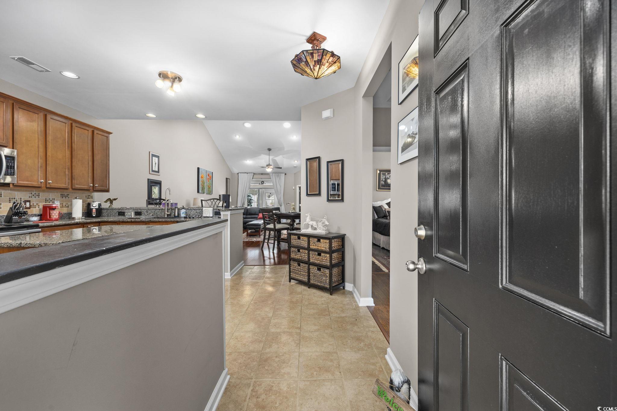 1602 Palmina Loop, Unit 34D Myrtle Beach, SC 29588 - Photo 6 of 28 Kitchen with decorative backsplash, light tile pat