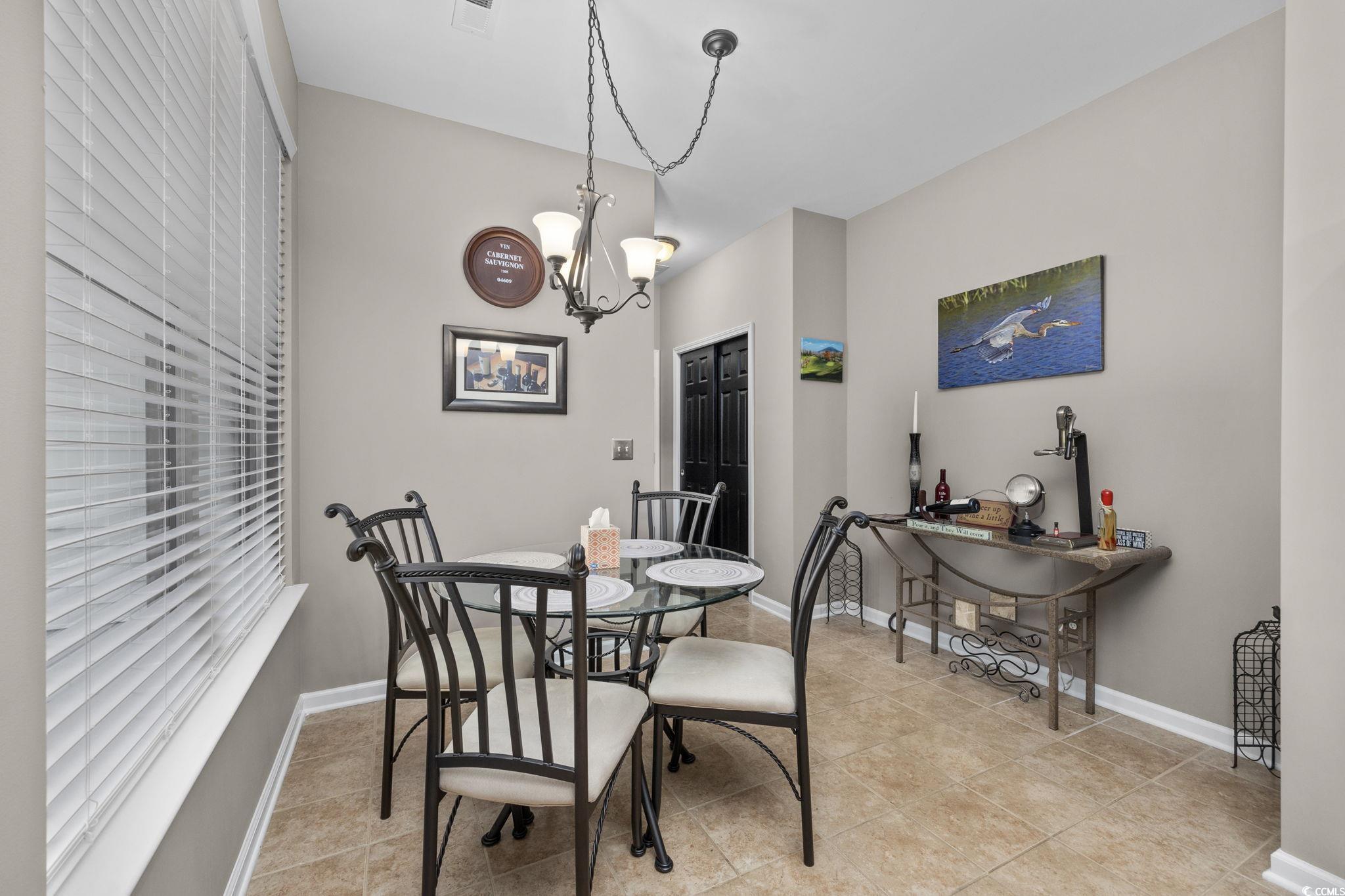 1602 Palmina Loop, Unit 34D Myrtle Beach, SC 29588 - Photo 8 of 28 Dining space with light tile patterned flooring an