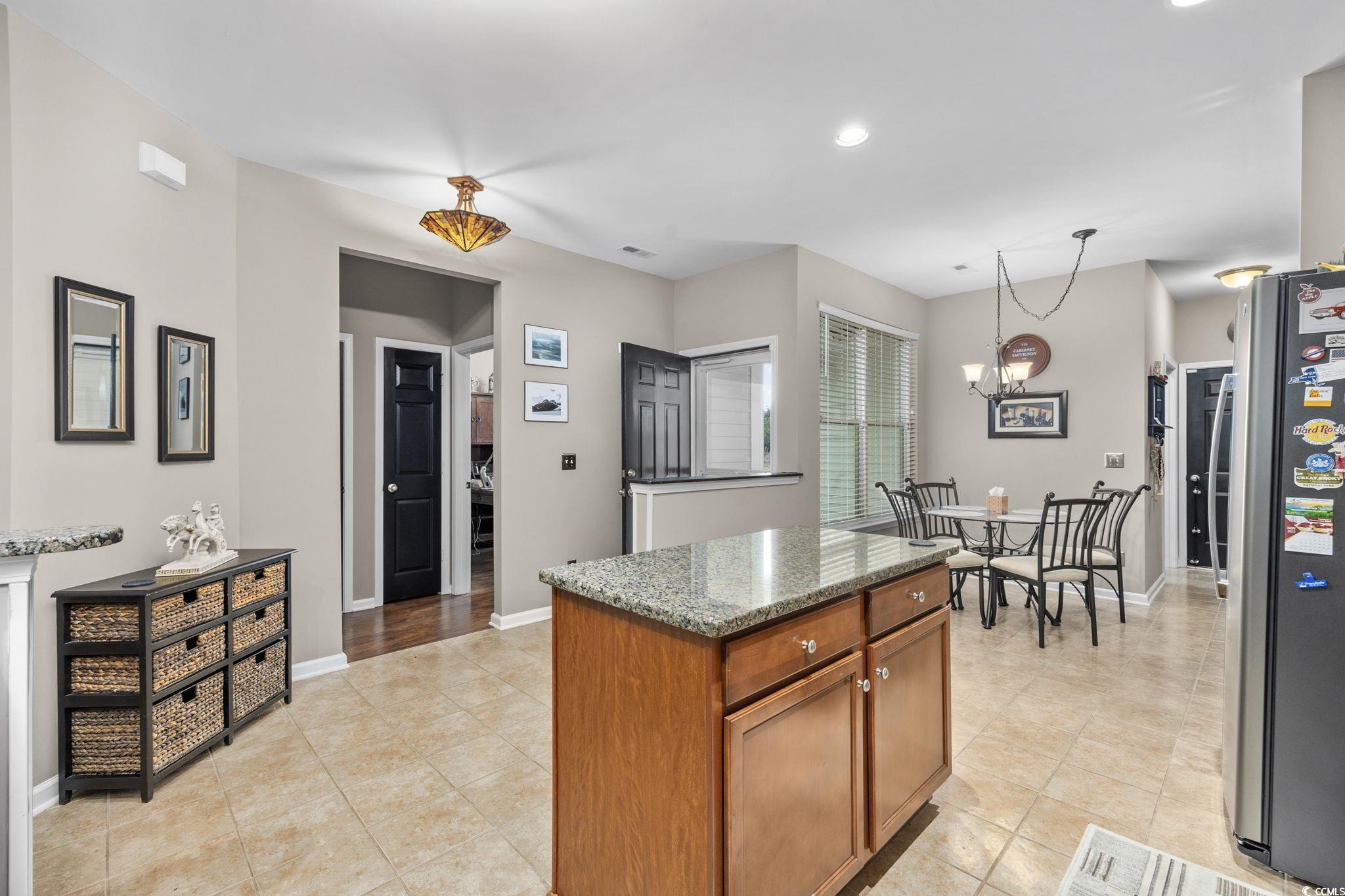 1602 Palmina Loop, Unit 34D Myrtle Beach, SC 29588 - Photo 10 of 28 Kitchen featuring light stone countertops, stainle