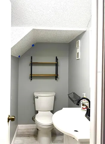 a view of a swimming pool with an outdoor seating and a yard