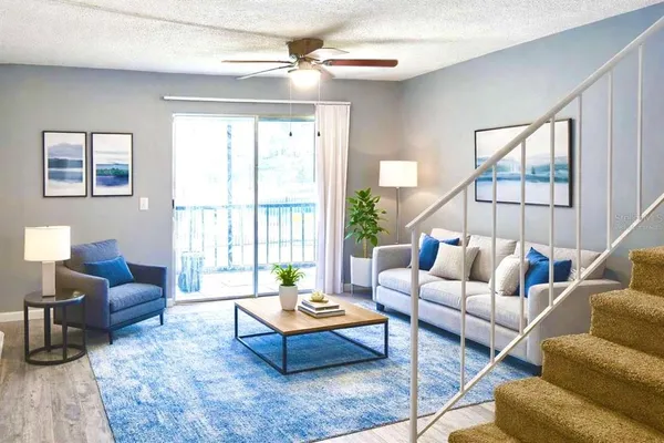a living room with furniture and a large window