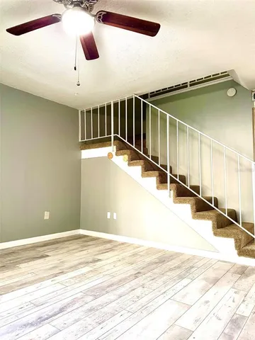 a view of a kitchen with wooden floor