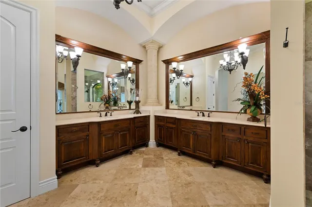 a bathroom with a granite countertop sink toilet a mirror and shower