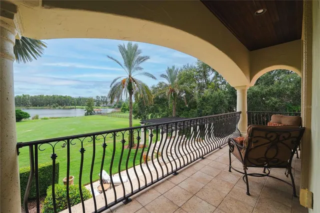 a front view of a house with swimming pool and furniture