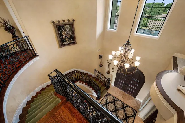 a view of a house with backyard porch and sitting area