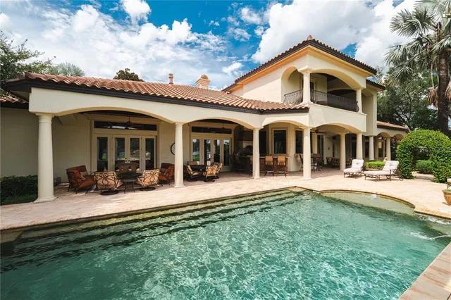 a view of a lake with houses in the back
