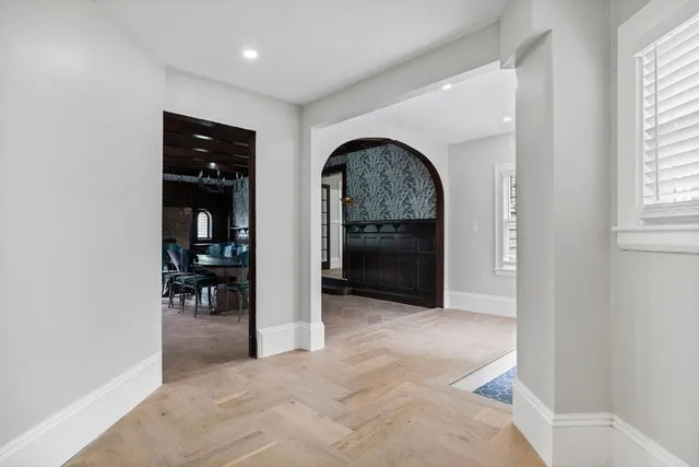 an empty room with closet and windows