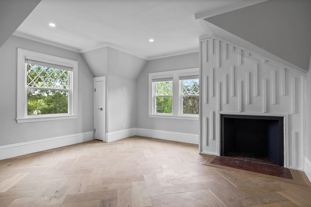 476 A Heath Street Brookline, MA 02467 - Photo 16 of 39 an empty room with windows and fireplace
