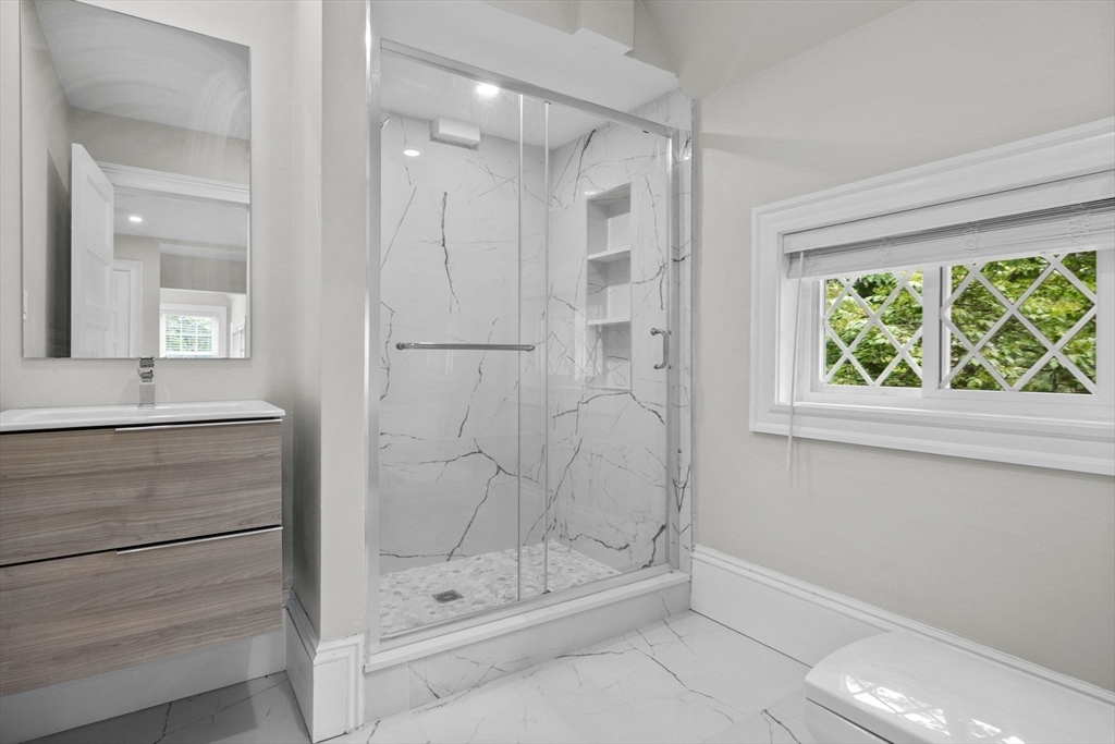 476 A Heath Street Brookline, MA 02467 - Photo 25 of 39 a bathroom with a shower and a sink