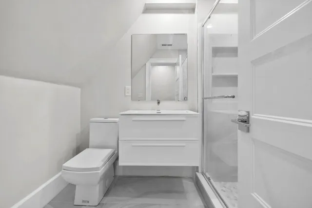 an empty room with a empty space and windows