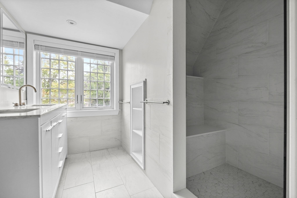 476 A Heath Street Brookline, MA 02467 - Photo 34 of 39 a bathroom with a granite countertop sink a toilet and shower