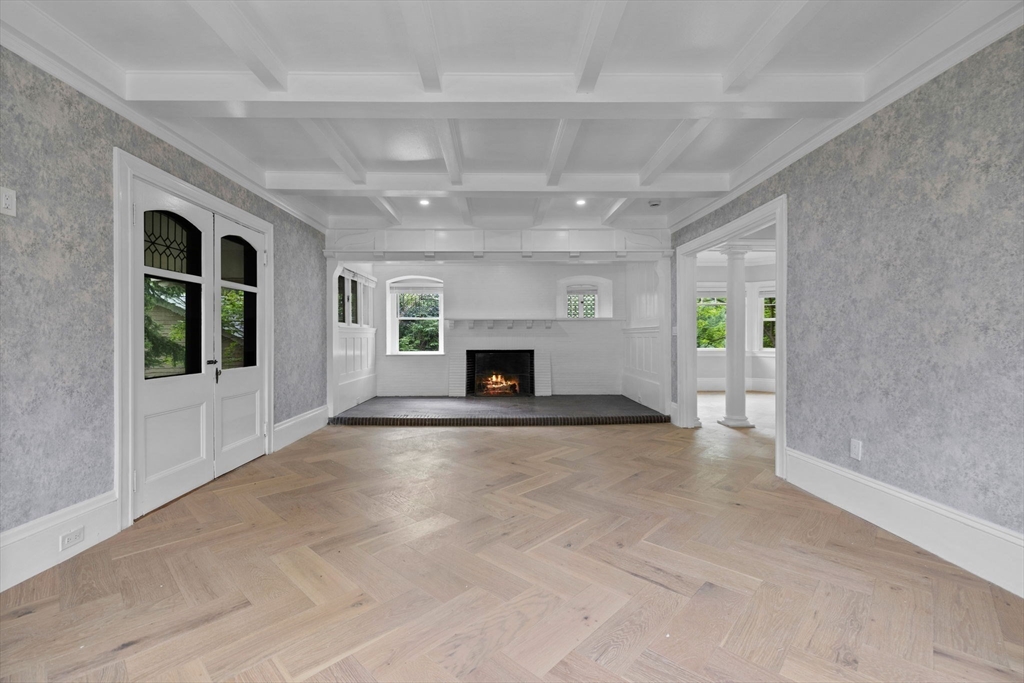 476 A Heath Street Brookline, MA 02467 - Photo 5 of 39 en empty room with windows and fireplace