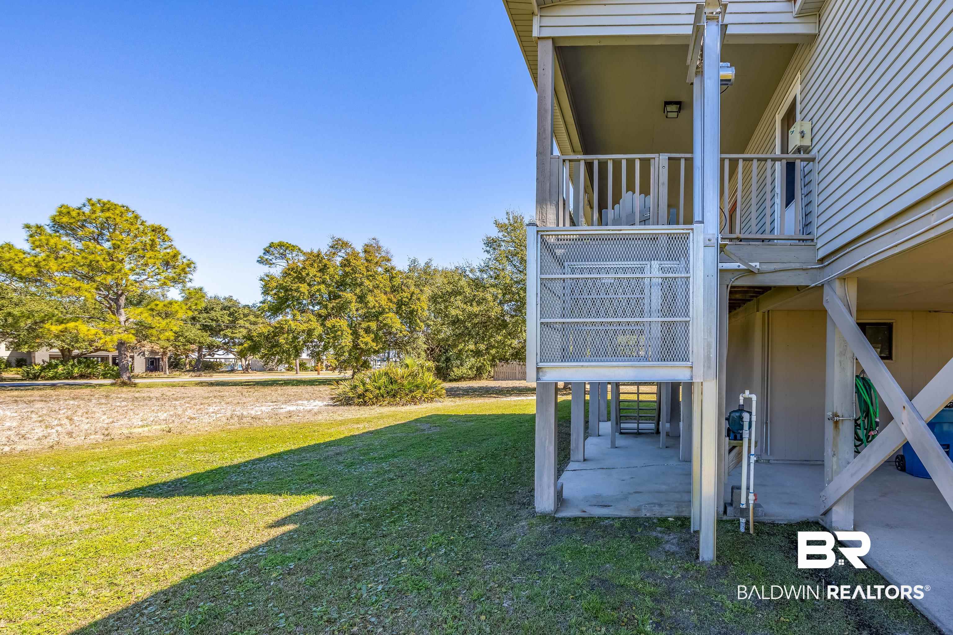 27321 Marina Road Orange Beach, AL 36561 - Photo 12 of 55 View of yard featuring a patio