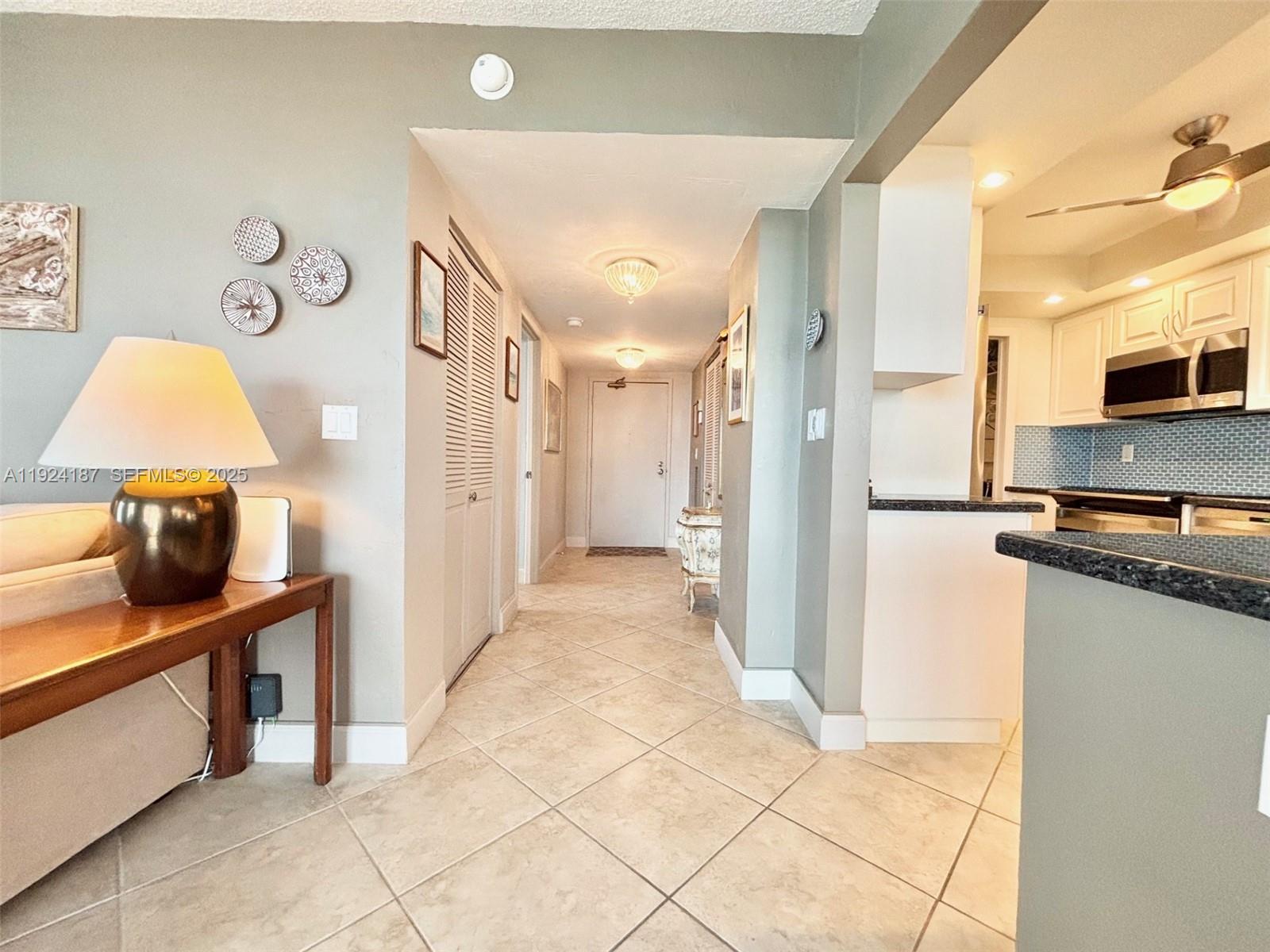 9273 Collins Avenue, Unit 705 Surfside, FL 33154 - Photo 16 of 40 a view of a kitchen with a sink
