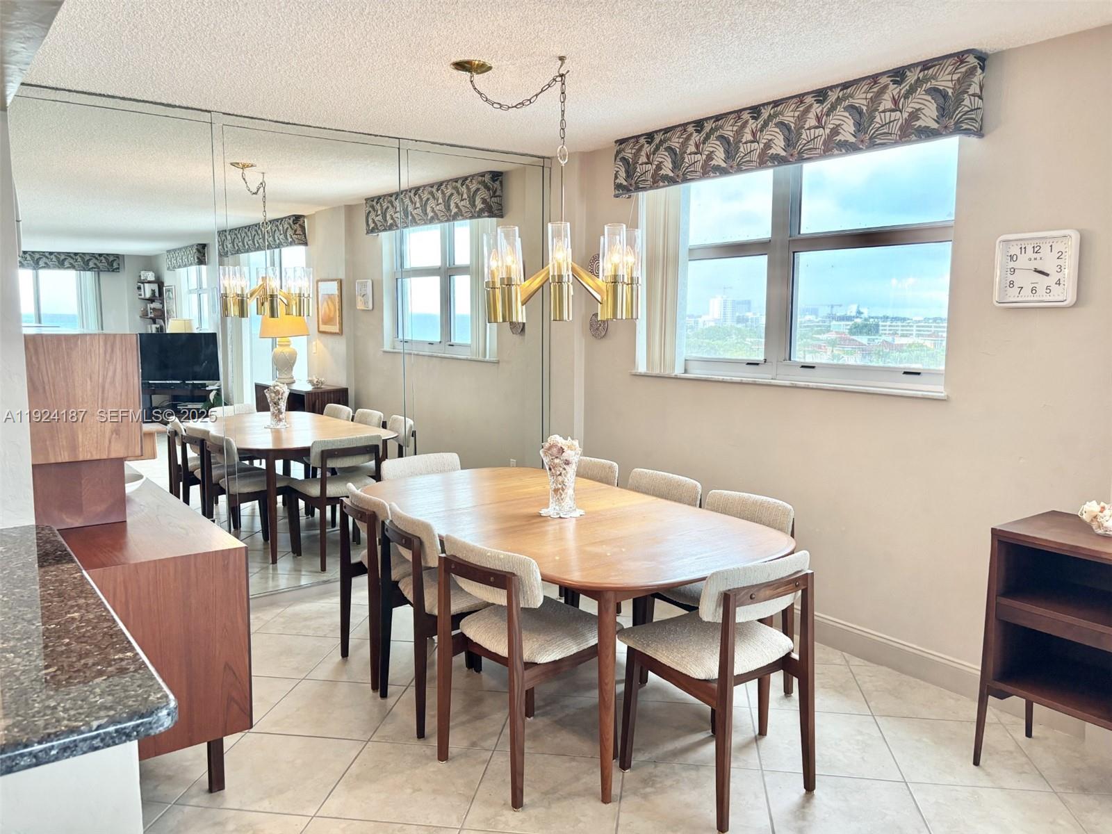 9273 Collins Avenue, Unit 705 Surfside, FL 33154 - Photo 21 of 40 a view of a dining room with furniture and window