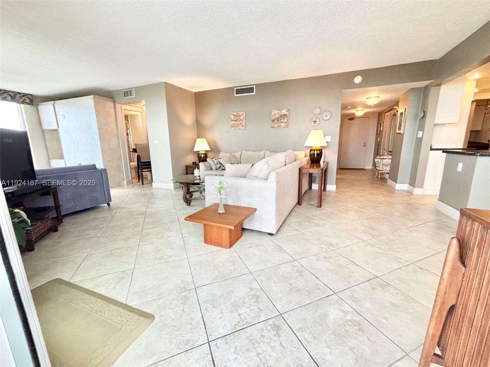 9273 Collins Avenue, Unit 705 Surfside, FL 33154 - Photo 25 of 40 a living room with furniture