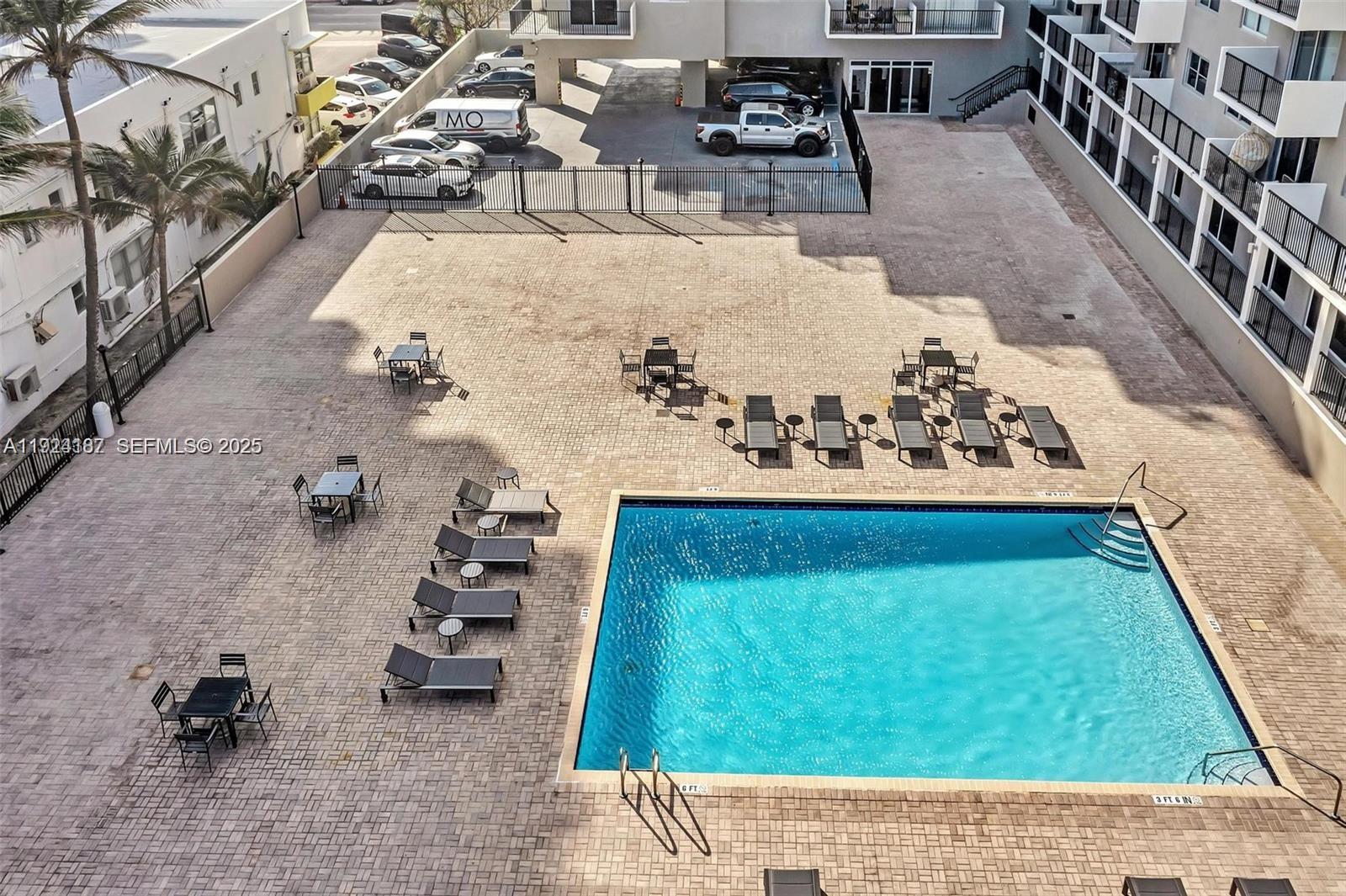 9273 Collins Avenue, Unit 705 Surfside, FL 33154 - Photo 40 of 40 view of living room with furniture and outdoor seating