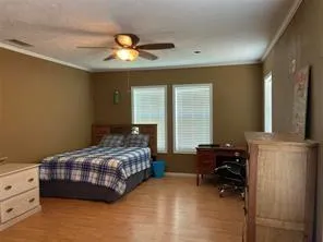 a kitchen with stainless steel appliances granite countertop a refrigerator a sink dishwasher a stove a microwave oven with cabinets and wooden floor