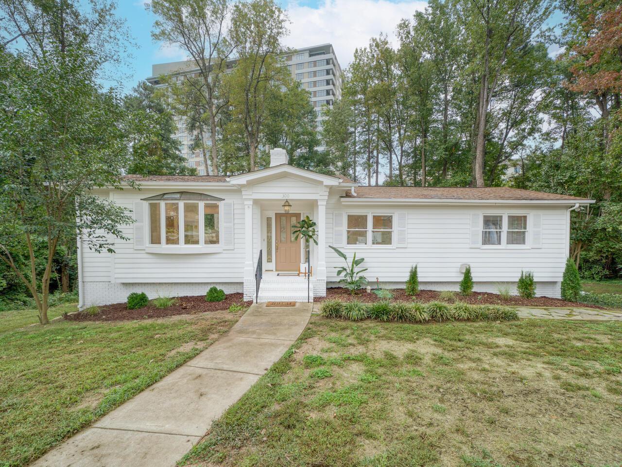 a view of a house with a backyard