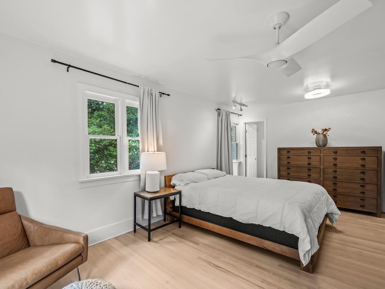 300 Dartmouth Road Raleigh, NC 27609 - Photo 15 of 28 a bedroom with a bed a couch and a window