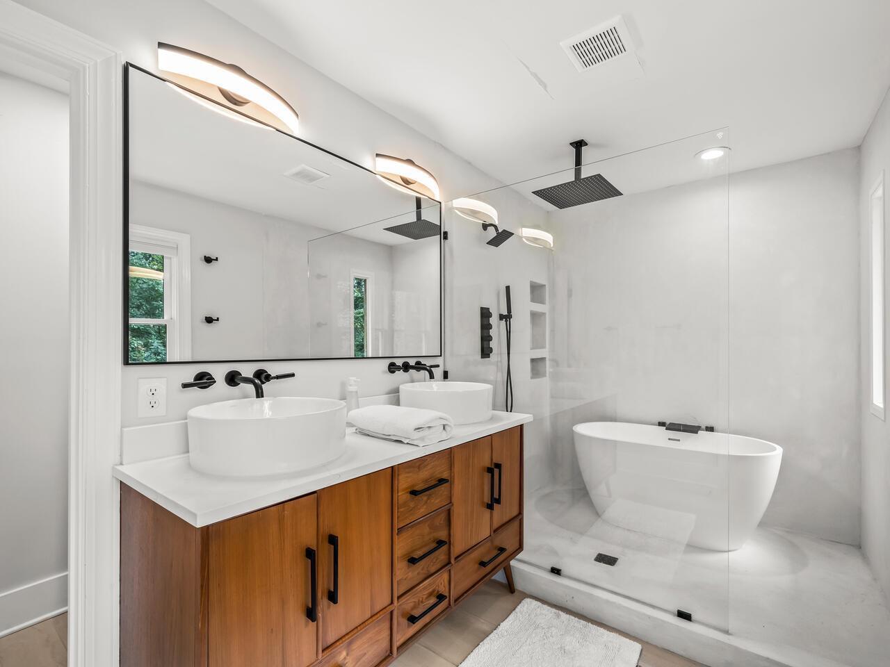 300 Dartmouth Road Raleigh, NC 27609 - Photo 16 of 28 a bathroom with a double vanity sink mirror and toilet