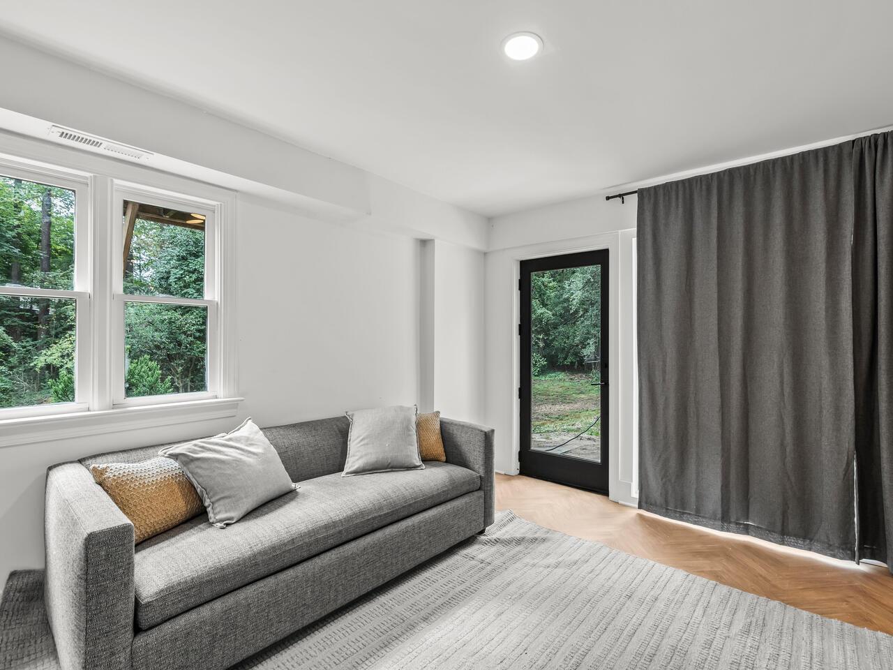 300 Dartmouth Road Raleigh, NC 27609 - Photo 17 of 28 a living room with furniture and a window