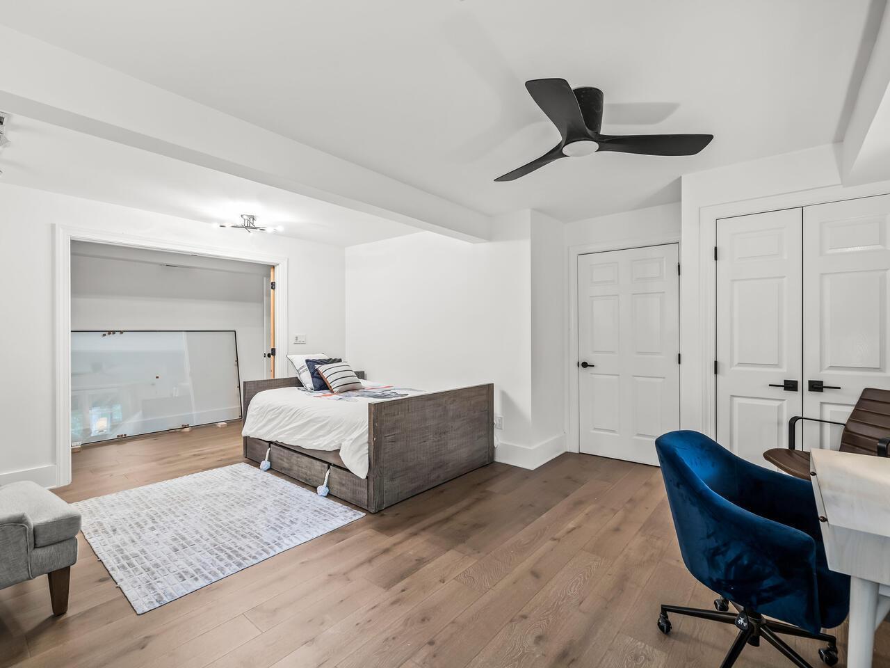 300 Dartmouth Road Raleigh, NC 27609 - Photo 19 of 28 a bedroom with furniture and a wooden floor