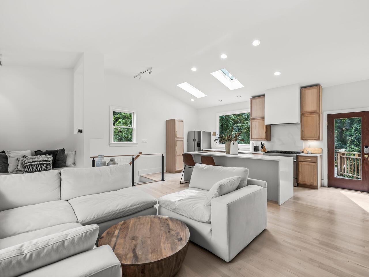 300 Dartmouth Road Raleigh, NC 27609 - Photo 5 of 28 a living room with furniture white walls and kitchen view