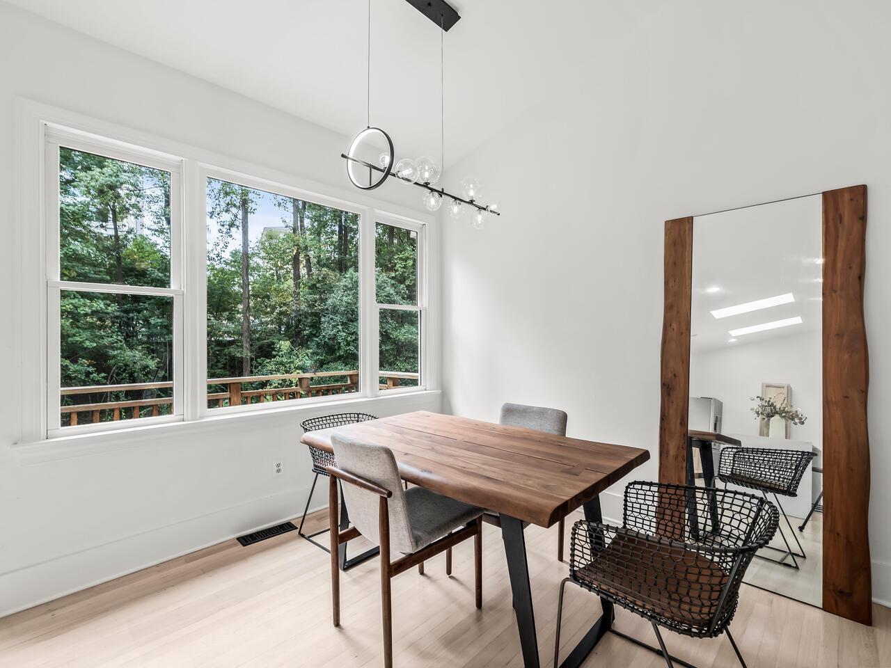 300 Dartmouth Road Raleigh, NC 27609 - Photo 10 of 28 a view of a dining room with furniture window and outside view