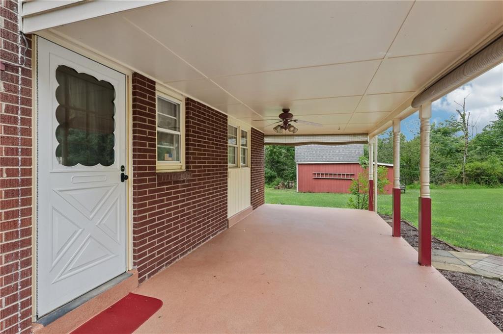 714 Colonial Drive Apollo, PA 15613 - Photo 16 of 32 a view of a porch with wooden floor and fence