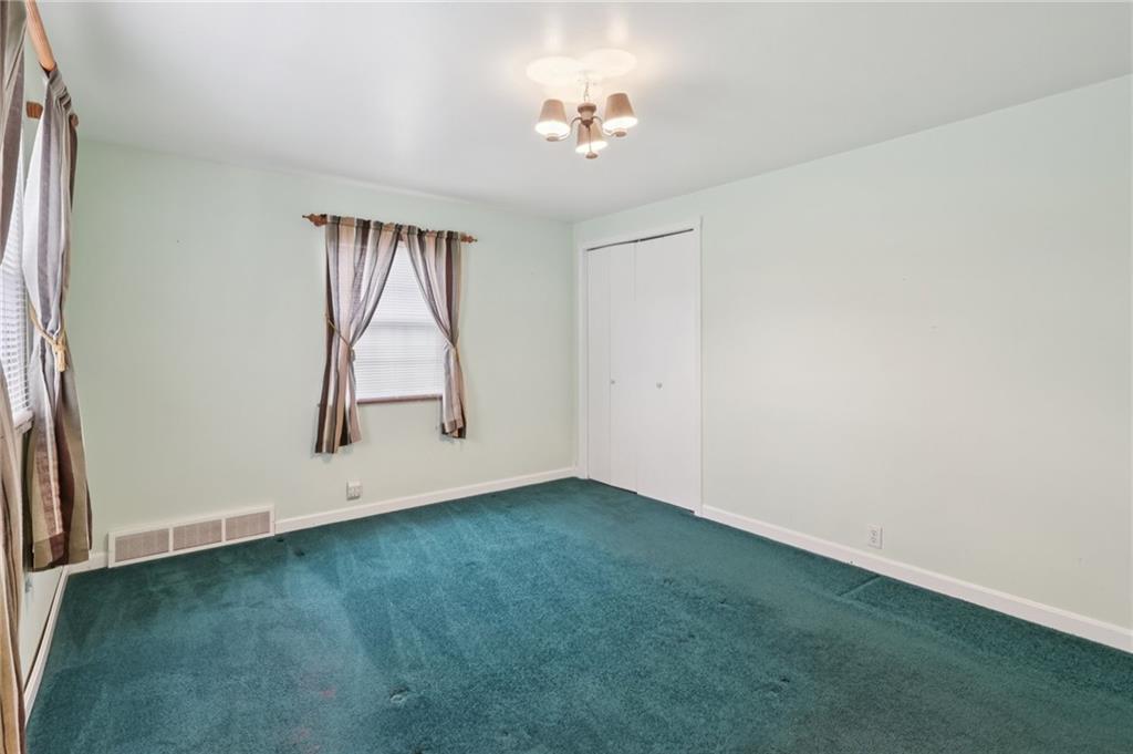714 Colonial Drive Apollo, PA 15613 - Photo 21 of 32 an empty room with a window and a ceiling fan