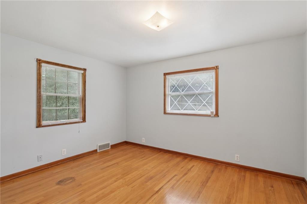714 Colonial Drive Apollo, PA 15613 - Photo 26 of 32 a view of an empty room with wooden floor and a window