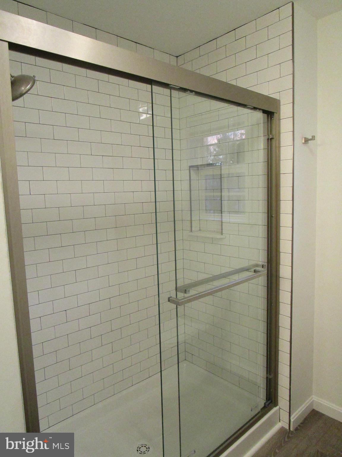 32 Tiffany Drive Rehoboth Beach, DE 19971 - Photo 27 of 43 a bathroom with a shower