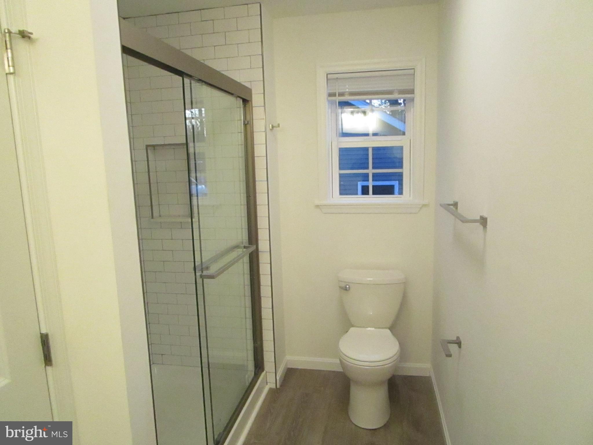 32 Tiffany Drive Rehoboth Beach, DE 19971 - Photo 28 of 43 a bathroom with a toilet and a shower