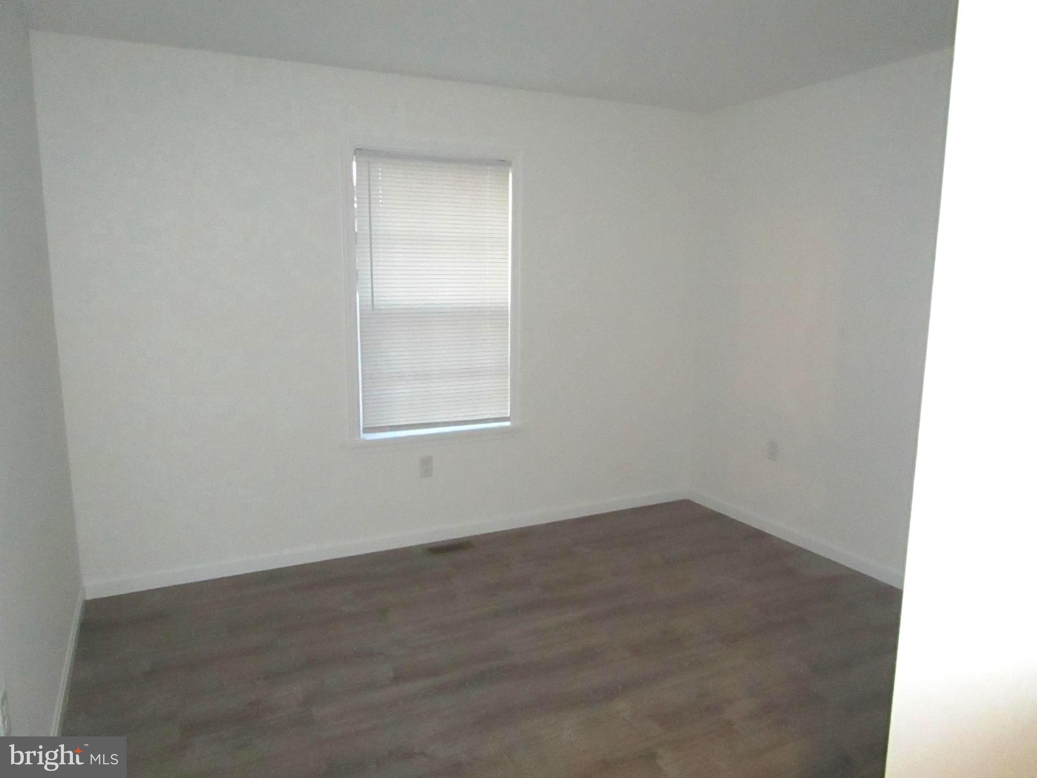 32 Tiffany Drive Rehoboth Beach, DE 19971 - Photo 30 of 43 an empty room with a window