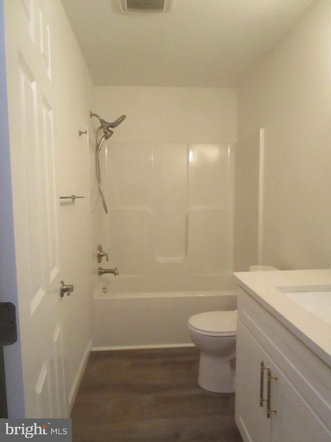 32 Tiffany Drive Rehoboth Beach, DE 19971 - Photo 32 of 43 a bathroom with a sink a toilet and shower